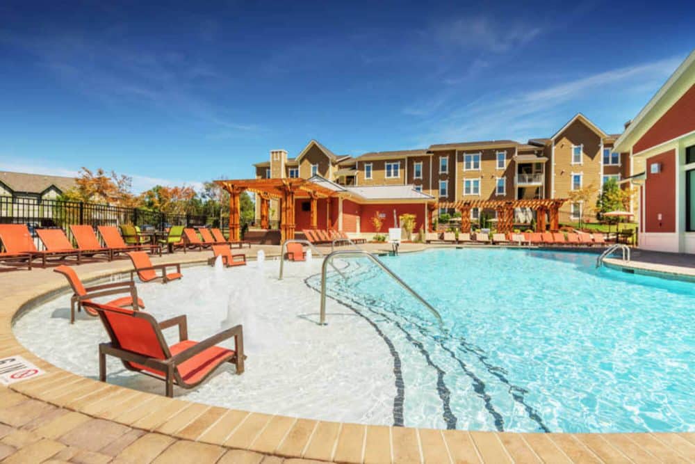 millenium one off campus apartments near the university of north carolina charlotte unc charlotte uncc resort style poo with swim up lounging deckl
